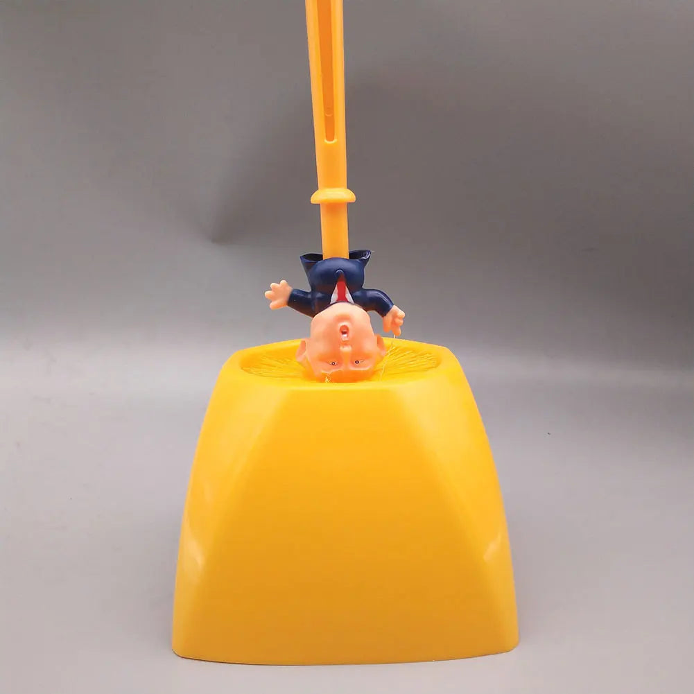 The Trump Tidy Toilet Brush is a bright yellow, novelty holder featuring an upside-down cartoon man in a suit resembling Trump, with the brush handle extending from his legs—a fun, quirky bathroom accessory for humorous decor lovers.