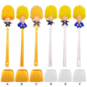 The Trump Tidy Toilet Brush features cartoon figure handles with yellow hair in blue suits, paired with matching holders labeled A to F (three yellow, three white). A humorous bathroom accessory for any fun-loving space.