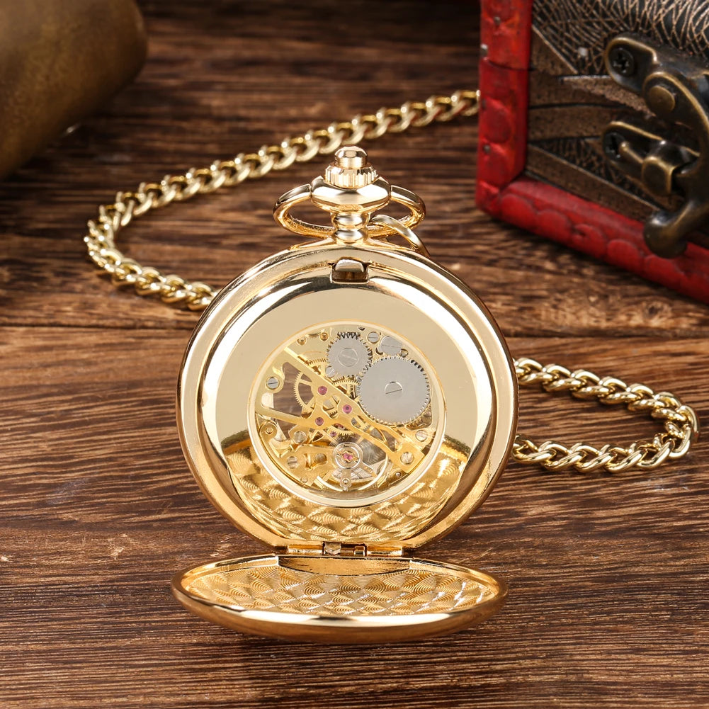The Golden Roman Pocket Watch, featuring a gold skeleton movement and open cover that reveals its intricate gears, rests on a wooden surface next to a decorative box.