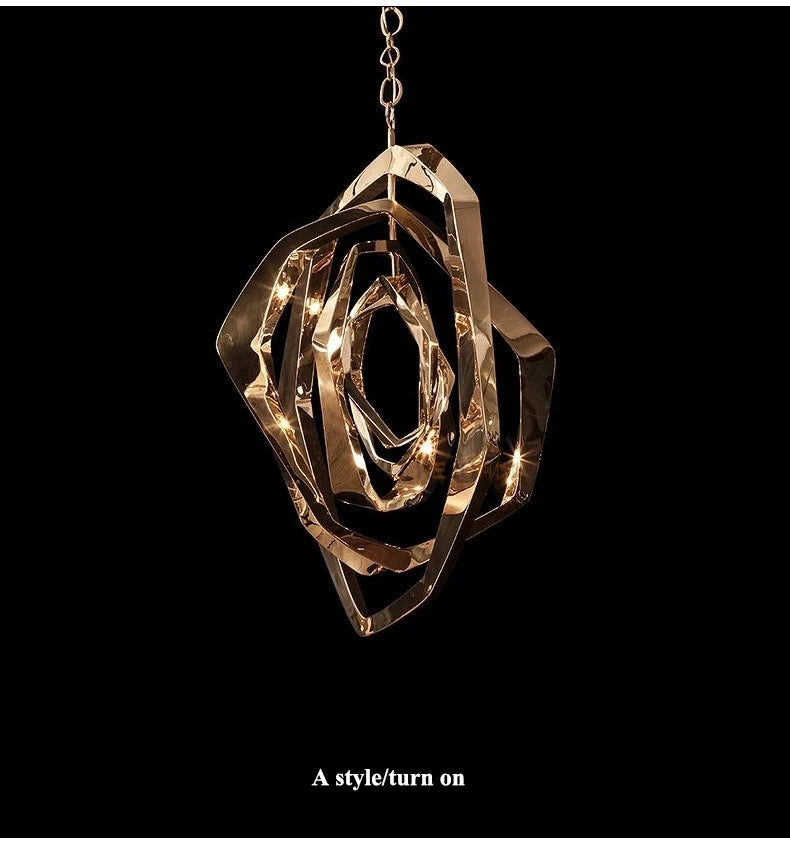 The Elegant Industrial Gallery Pendant, a modern abstract LED light in gold, hangs against a black background with the text "A style/turn on" below it.