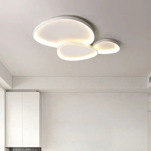 The Nordic Minimalist Ceiling Light, with overlapping circular designs, emits a soft white glow that integrates seamlessly into any minimalistic space. It offers dimmable brightness, allowing perfect ambiance control.