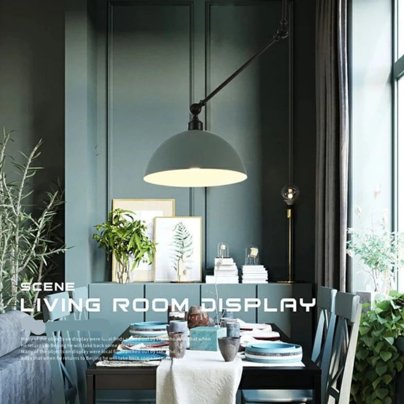 Modern dining area with green walls, showcasing an industrial design. A Zig Zag Pendant Light hovers above a table set for four, complemented by plant decor. Text reads "Scene: Living Room Display".