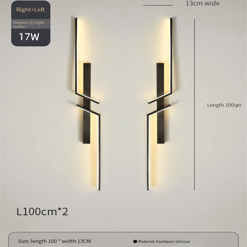 Two Minimalist Wall Sconce lights with LED, black hardware, and silicone construction—each 100cm x 13cm—are mounted side by side on a light wall for striking modern decorative lighting.