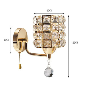 The Luxury Cylinder Wall Light features a crystal-covered lampshade, pull chain, and hanging crystal ornament; sized at 12 cm wide, 10 cm base height, and 22 cm total height—ideal for adding a touch of luxury to any space.