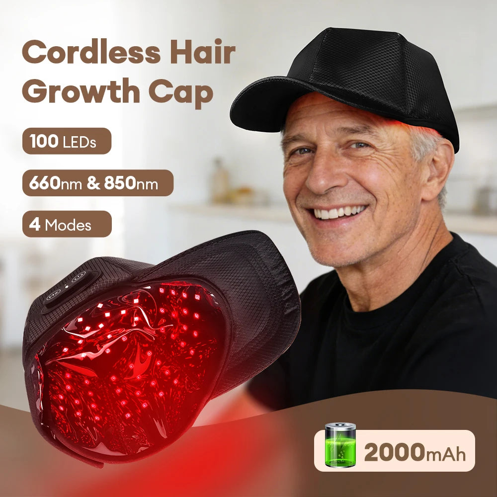 Cordless heated cap for hair growth on a smiling man, featuring 100 red LEDs, 660nm and 850nm wavelengths, four modes, and 2000mAh battery.