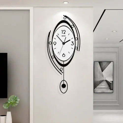 The Zen Arc Oval Statement Clock showcases a modern Nordic black and white design with an oval shape and hanging pendulum, elegantly displayed on a white wall in a minimalist room.