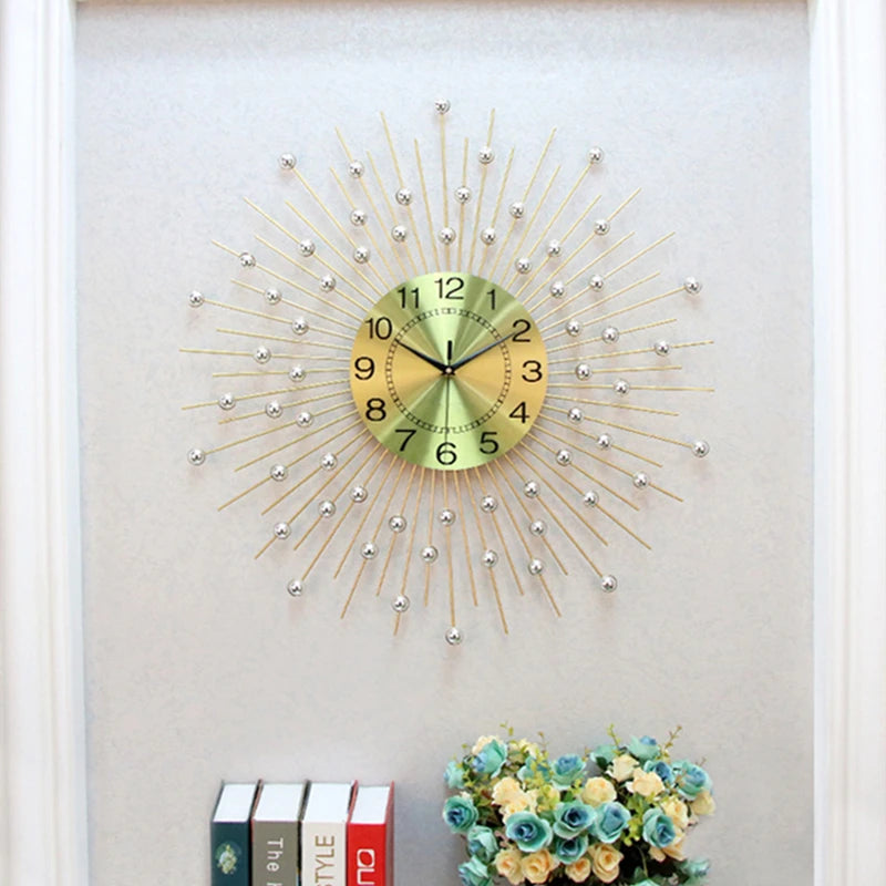 A Lux Radiance Starburst Wall Clock hangs above a small shelf displaying books and a bouquet of artificial flowers.