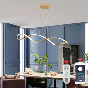 A modern dining room features blue paneled walls, a table with decorative items, and the Stylish Pendant Light highlighting sculptural elegance. In the foreground, a remote control and smartphone app emphasize the light's minimalist design.