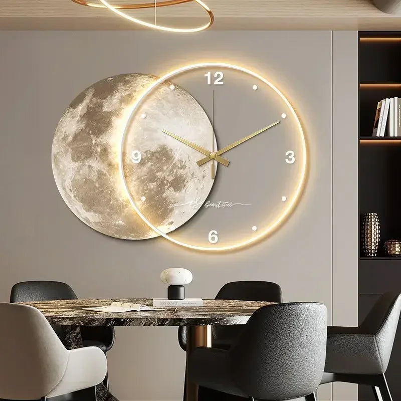 A modern dining room showcases a round table and four chairs, complemented by the Celestial Wall Clock Light, which features a moon design and illuminated numbers for unique home decor flair.