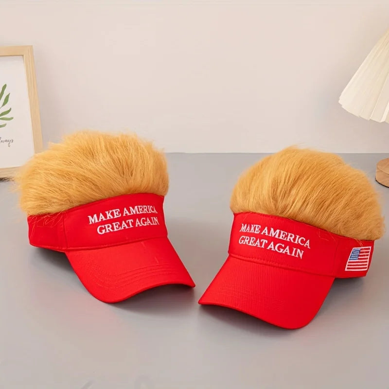 Two Visor Cap - Make America Great Again hats, each red with attached fake blond hair, are shown side by side on a gray surface—a humorous and patriotic accessory for spirited conversations.