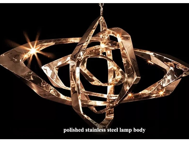 The Elegant Industrial Gallery Pendant features a modern, abstract LED design with a polished stainless steel lamp body, shown illuminated against a black background.