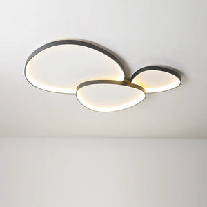 The Nordic Minimalist Ceiling Light offers a sleek design with three overlapping circular panels, providing a soft, warm glow. Its dimmable brightness and adjustable color temperature allow you to set the perfect ambiance for any mood or setting.