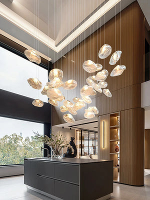 Modern kitchen with large floor-to-ceiling windows, wood paneling, and a Luxe Cloud Glass Pendant Light hanging above the central island as an elegant focal point.