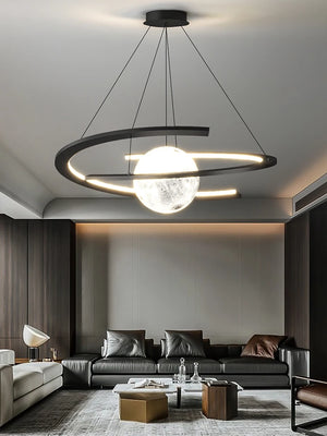 Modern living room with a Moon Trajectory Pendant Light resembling a planet, featuring a black sofa, two small tables, and minimalist design enhanced by cutting-edge LED technology.