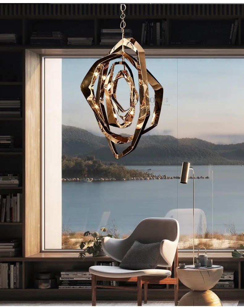 A modern living room with the Elegant Industrial Gallery Pendant, a floor lamp, and an armchair, featuring a large window overlooking a lake and hills.
