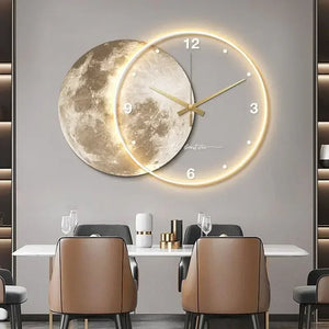 A dining room showcases the Celestial Wall Clock Light with cosmic imagery above a table, surrounded by chairs.