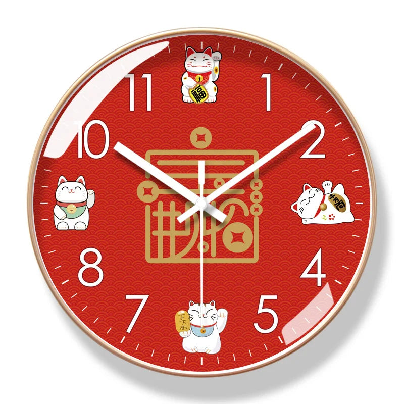 The Cartoon Cat Wall Clock is red with white numbers and hands, featuring four cartoon cat illustrations at 1, 4, 7, and 10 o’clock plus a gold Chinese symbol in the center—ideal as a lucky charm for your home or office decor.