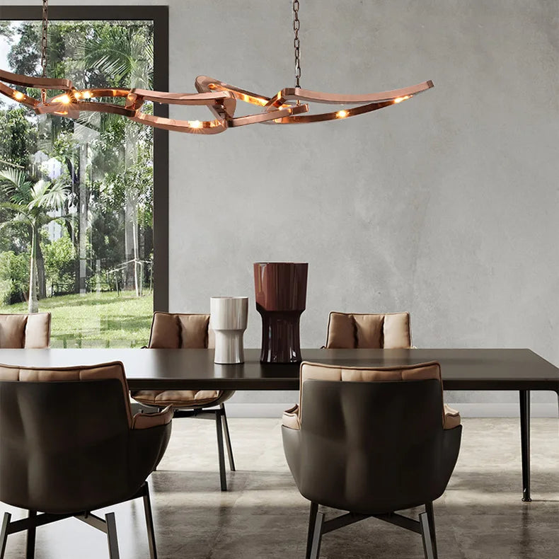 Modern dining room with a rectangular table, four cushioned chairs, three decorative vases, concrete floor, large window with lush greenery, and an Elegant Industrial Gallery Pendant as the sculptural LED light fixture.