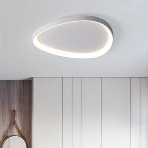 A Nordic Minimalist Ceiling Light brightens a room with white-paneled walls and a wooden accent wall with a round mirror.