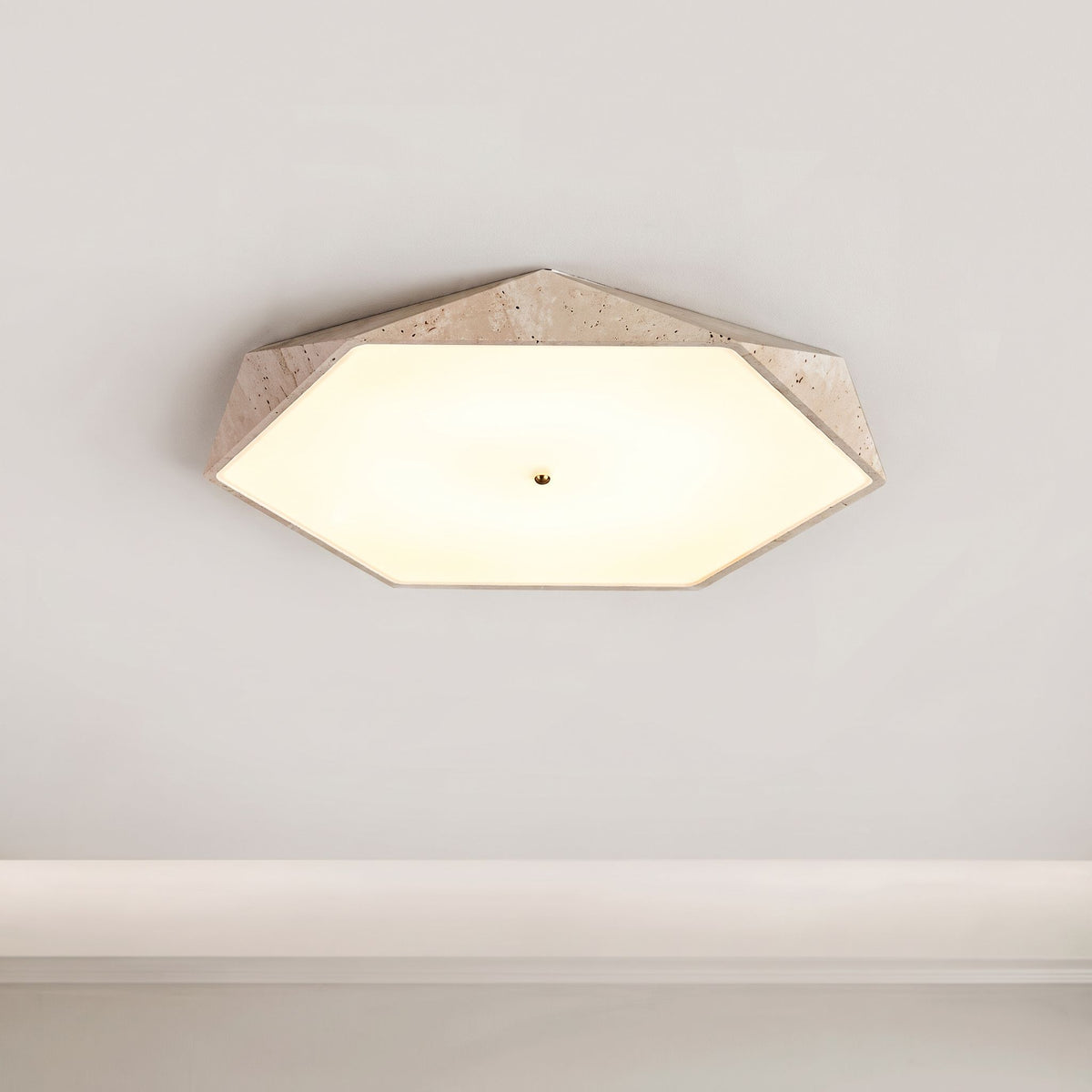 Natural Stone Ceiling Light with a beige frame inspired by wabi-sabi aesthetics and a frosted cover, mounted on a white ceiling.