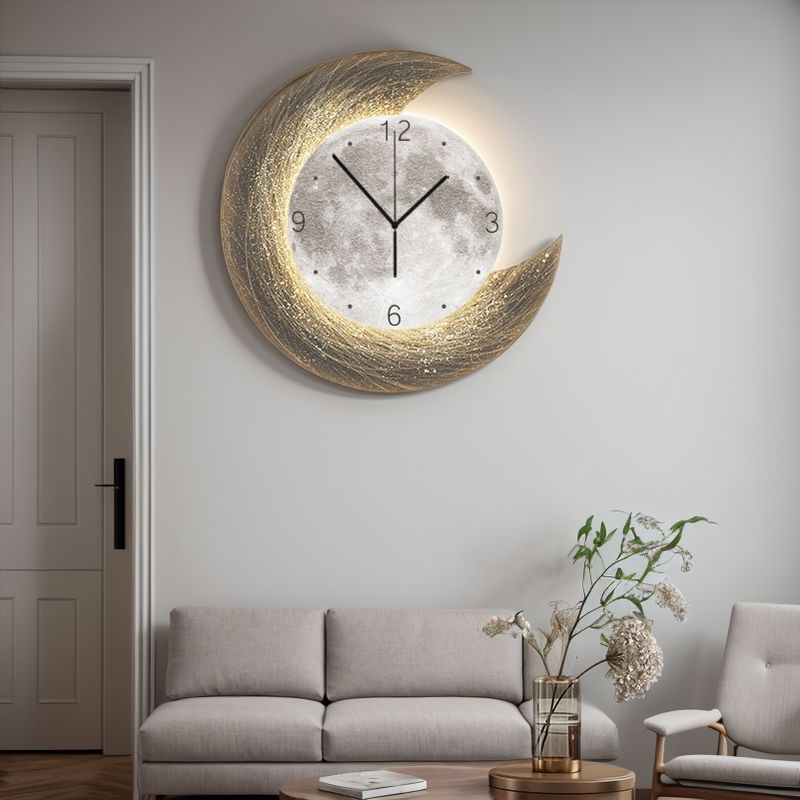 The Concentric Orbit Minimalist Wall Clock hangs above a light gray sofa in a modern living room with neutral decor, statement lighting, and a vase of flowers on the coffee table.