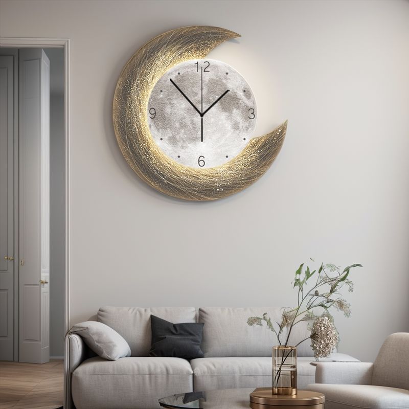 A modern living room featuring the Concentric Orbit Minimalist Wall Clock above a light gray sofa and a coffee table with a vase of flowers, bringing statement lighting and contemporary style to the space.