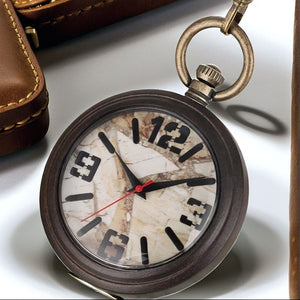 A close-up of the Vintage Style Pocket Watch with a marbled face, bold black hour markers, and a red second hand, shown beside a brown leather case.