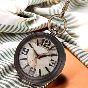 A Vintage Style Pocket Watch with a cracked face rests on striped fabric, its dark wood case and brown surface partially visible.