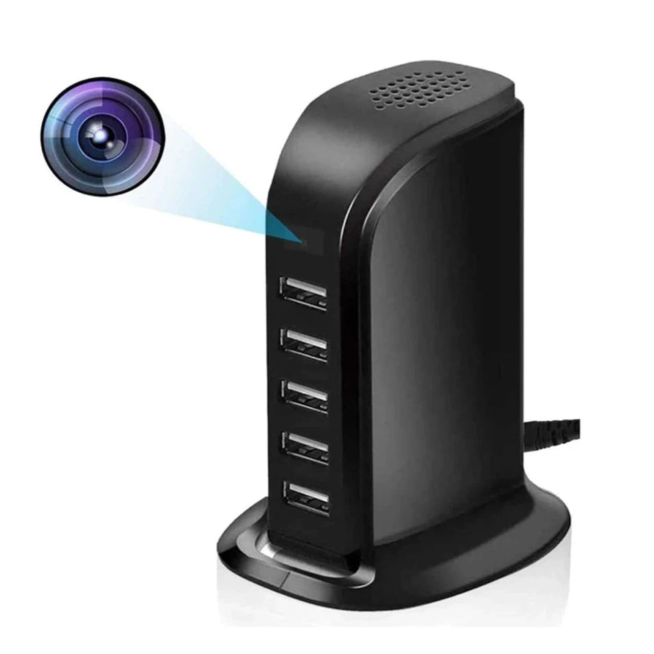 The SpyCam Charger Hub (5 USB Ports) is a black multi-port USB charger featuring a hidden HD spy camera at the top for WiFi real-time monitoring.