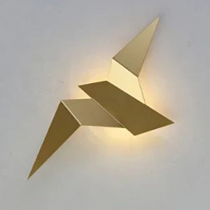 A Modern Flying Bird Wall Sconce, wall-mounted and featuring geometric, angular shapes with a metallic finish, illuminated against a plain background.