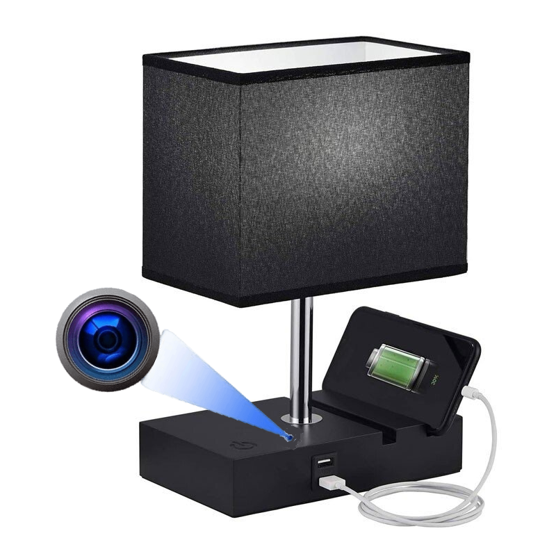 The Desk Lamp Charger SpyCam features a black table lamp with a rectangular shade, discreet 1080P HD hidden camera, and a USB port at the base for smartphone charging.