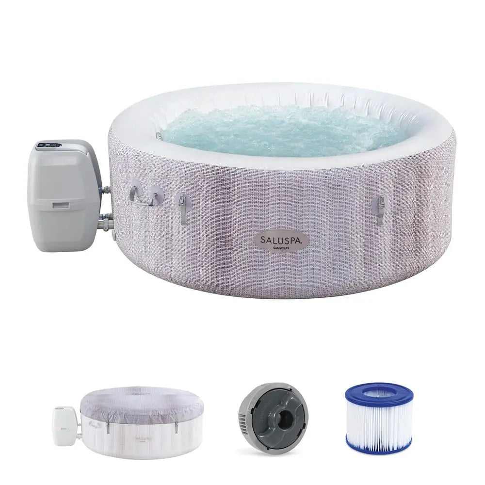 The Inflatable Hot Tub is shown filled with water and features an attached pump. This outdoor spa comes with accessories such as a filter cartridge and a control unit.