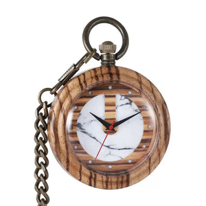 The Timeless Wooden Pocket Watch features a round case, wood and marble pattern face, metal chain, black hour and minute hands, and a red second hand for a modern vintage look.