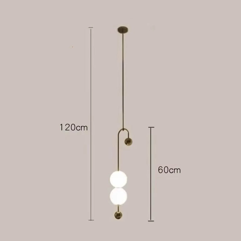 The Minimalist Line Light features three vertically arranged spherical bulbs, offering a sculptural touch. It measures 120cm in length and 60cm in width, embodying modern lighting with its sleek design.