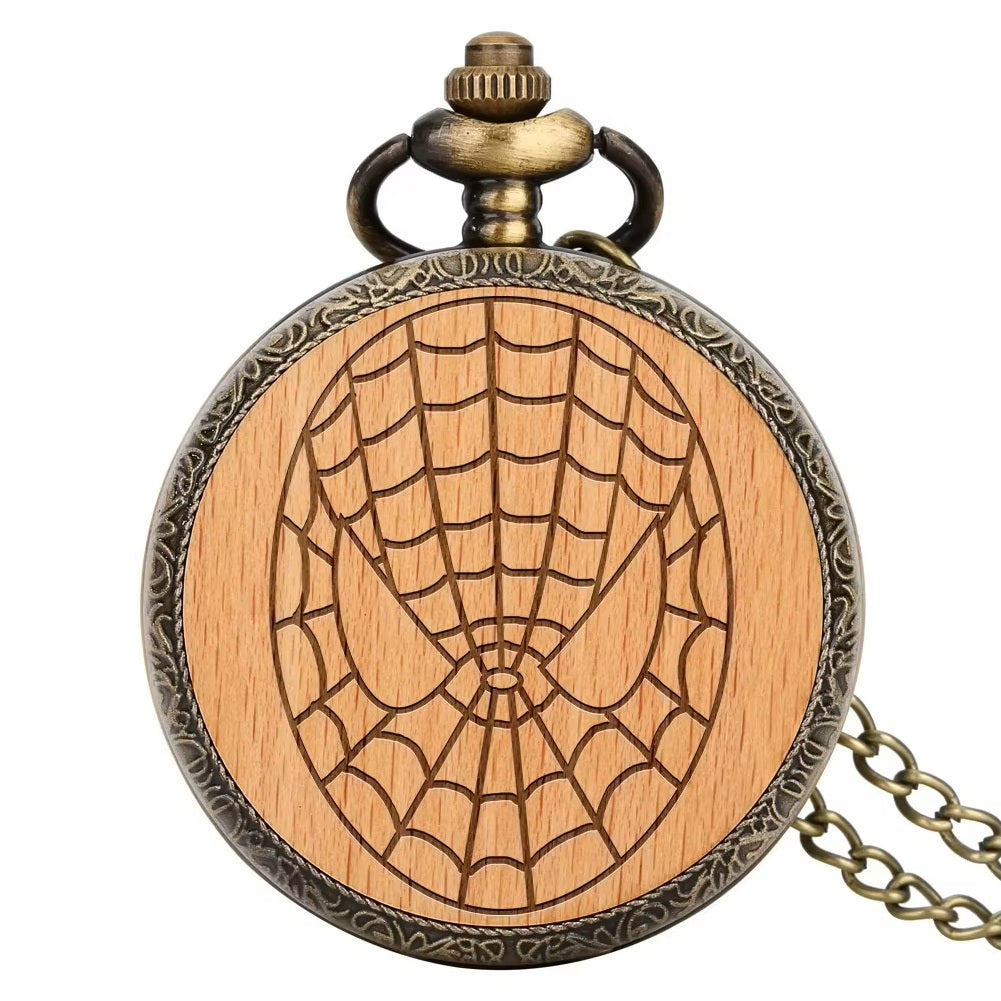 The Spiderman Pocket Watch features a vintage-style wooden cover engraved with a spiderweb design and comes with an attached metal chain.