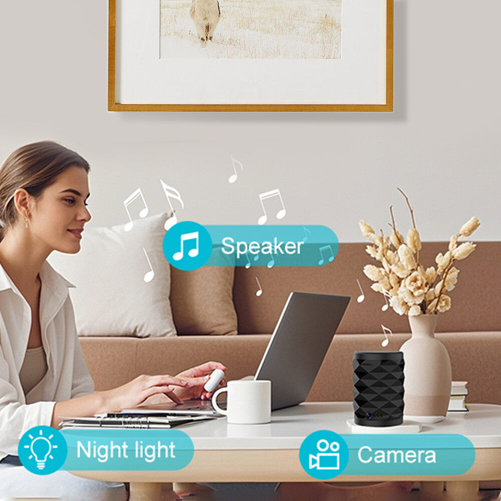 A woman sits at a table using a laptop, with a coffee cup, vase, and the Bluetooth Speaker SpyCam offering 24/7 security. Icons and music notes emphasize the device’s covert home monitoring features.