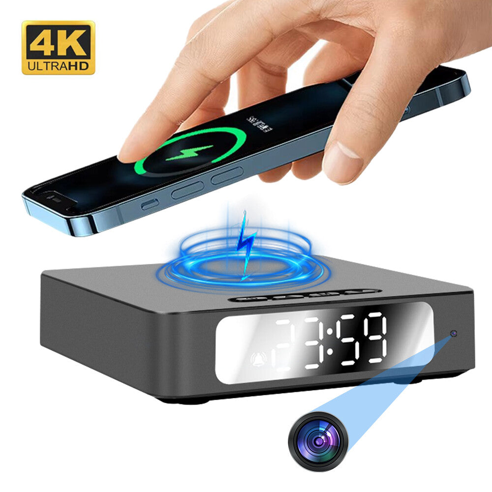 A hand sets a smartphone on the Wireless Charger Clock SpyCam, which features a hidden camera, motion detection, and a "4K ULTRAHD" label. The digital clock displays 3:59.