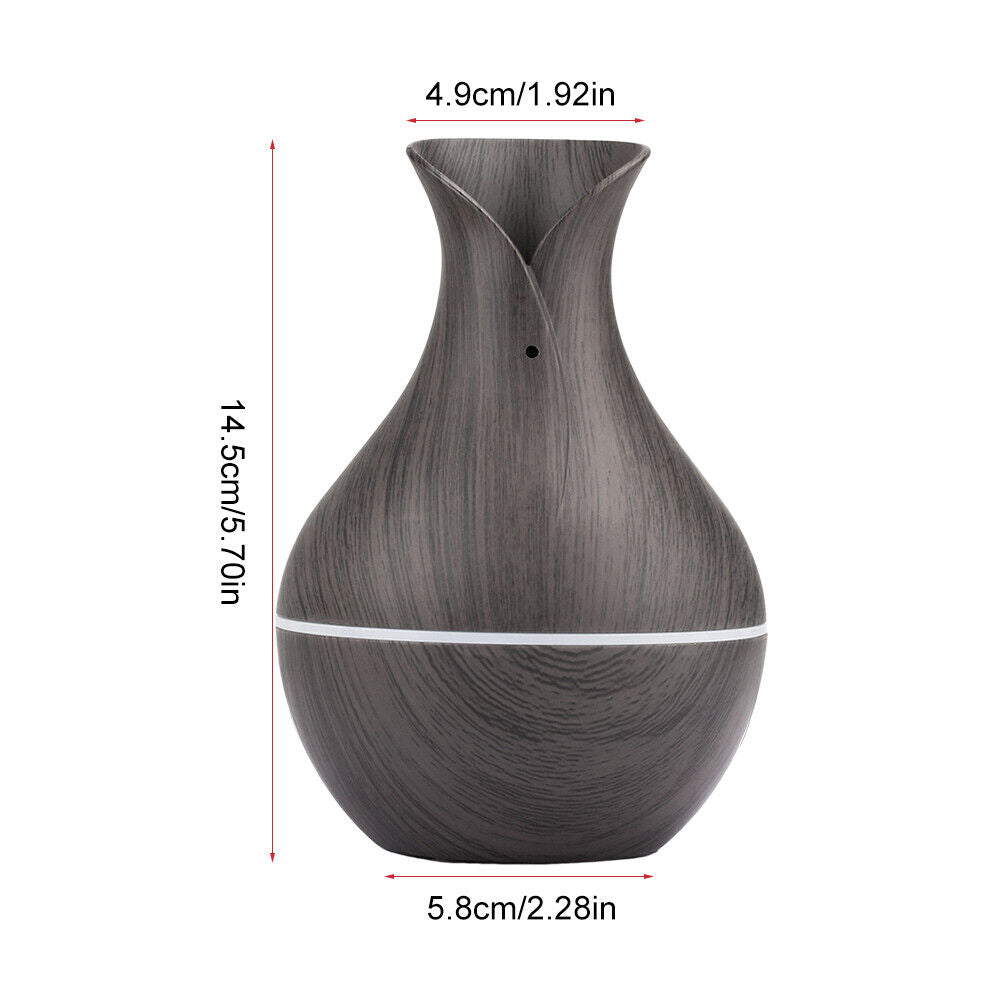 The Black Decorative Display SpyCam, perfect for home décor, features a dark wood-patterned vase shape with dimensions of 14.5cm in height, a 4.9cm top diameter, and a 5.8cm base diameter.