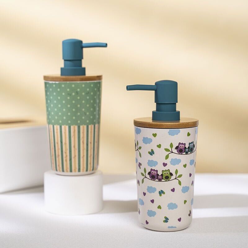 Two decorative soap dispensers with wooden lids sit on a white surface. One, named the Cute Decorative Display SpyCam, features polka dots and stripes, cleverly doubling as a spy cam. The other, hiding a discreet 1080P camera for recording, showcases cartoon owls and clouds.