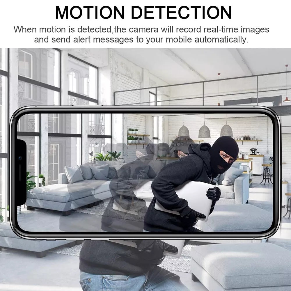 A burglar in the living room holding a laptop is captured by the state-of-the-art US Outlet SpyCam, offering exceptional HD clarity and advanced motion detection technology for your peace of mind.