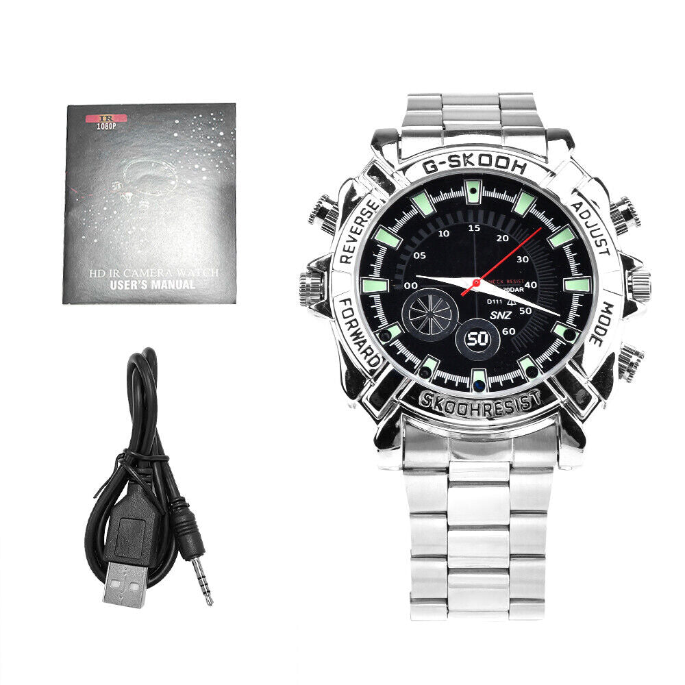 The Watch SpyCam, shown with its USB cable and manual on a white background, is a silver wristwatch with multiple buttons that discreetly records 1080P video and audio for enhanced security and convenience.