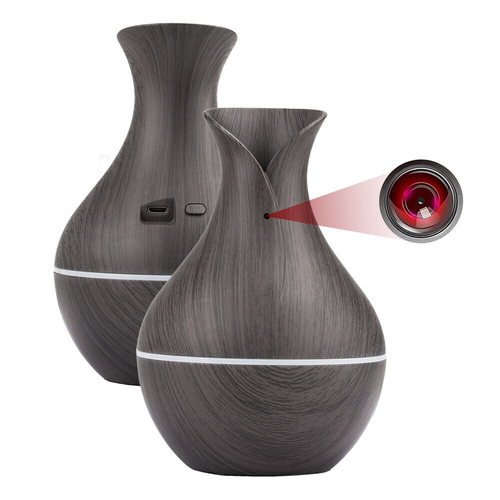 Two Black Decorative Display SpyCams with hidden camera technology feature a close-up of a lens and blend seamlessly into your décor, offering espionage tools like USB ports and control buttons.