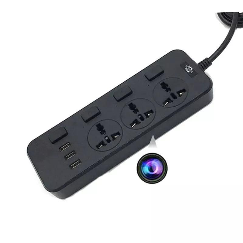 The Power Strip SpyCam, a black power strip featuring three electrical outlets, three USB ports, and an inconspicuous round object with a multicolored ring beside it, is ideal for covert surveillance with its ability to record in 1080P HD video quality.