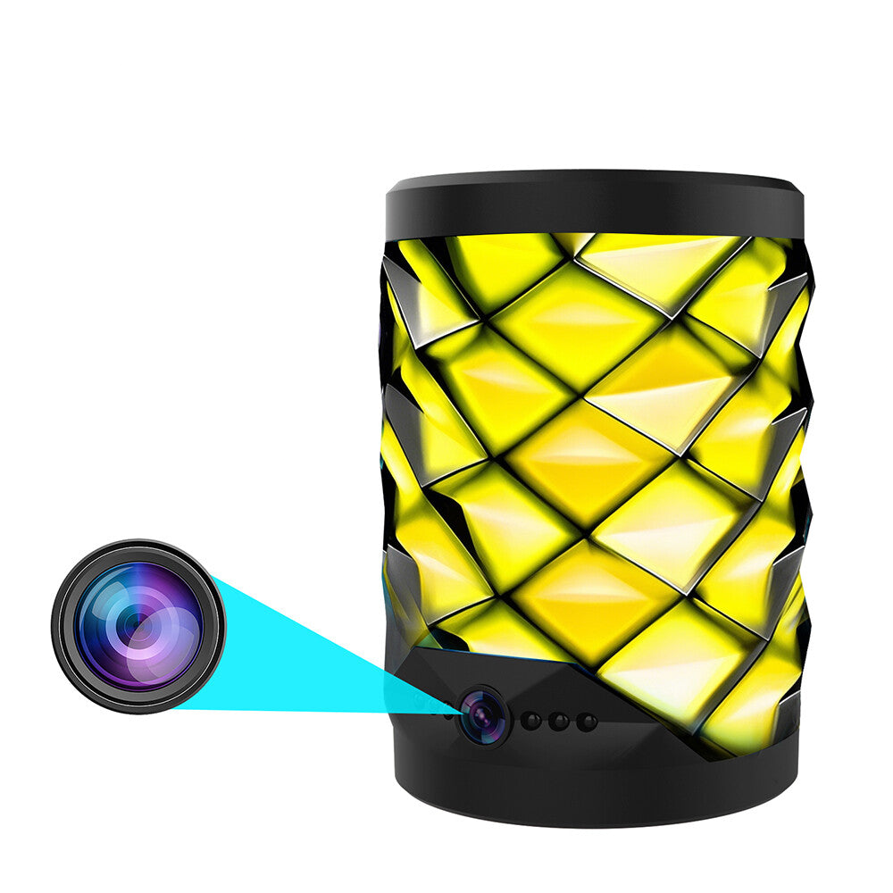 The Bluetooth Speaker SpyCam is a black and yellow cylindrical device with a geometric pattern, featuring a hidden camera lens—ideal for discreet home monitoring.