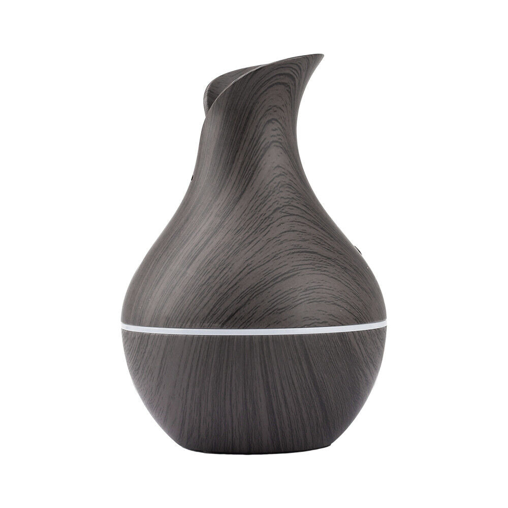 The Black Decorative Display SpyCam, with its vase-shaped dark wood-grain design and narrow top, seamlessly blends into any home décor.