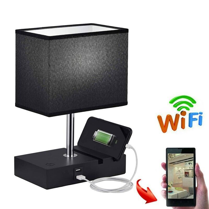 The Desk Lamp Charger SpyCam features a black rectangular shade and includes a smartphone charging base. It offers discreet surveillance with an HD 1080P camera, subtly integrated with WiFi connectivity for enhanced security.