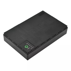 Portable UPS for WiFi Router, a black rectangular electronic device with a power button and indicator lights on one side, offering 10400mAh capacity for reliable WiFi router power backup.