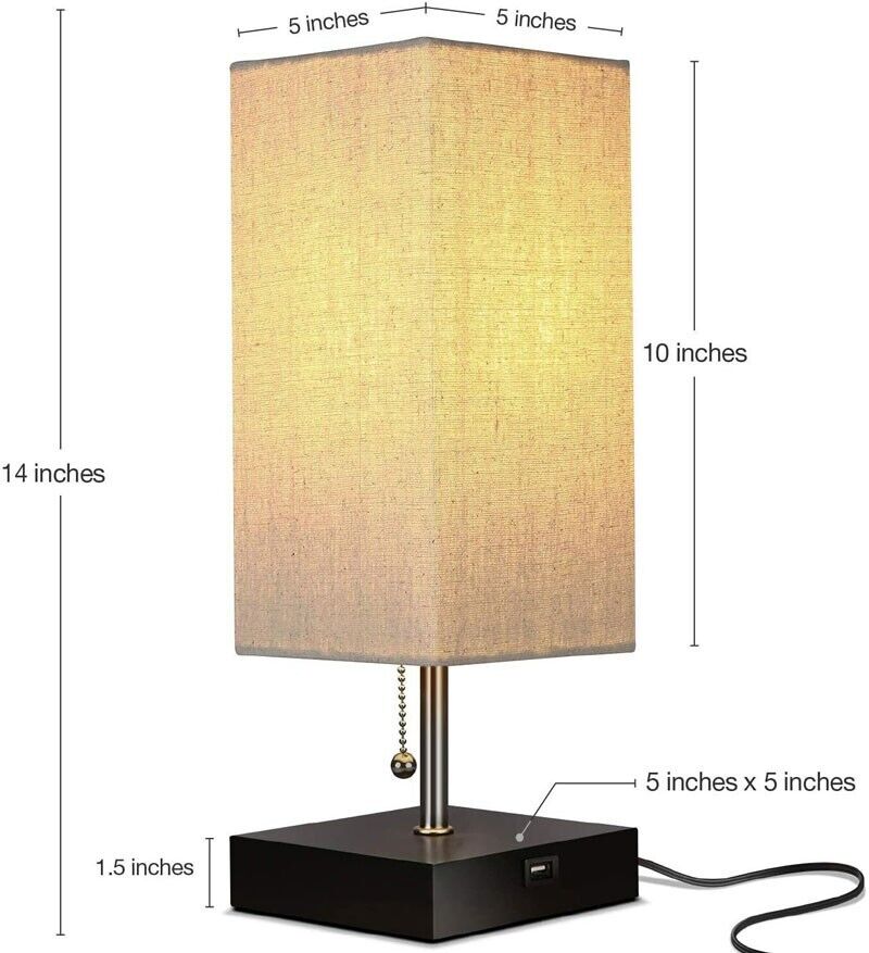 The Desk Lamp Charging SpyCam is a rectangular lamp with a beige shade, standing 14 inches tall and 5 inches wide. Its sleek black base includes a pull chain and USB port, inspired by James Bond design aesthetics.