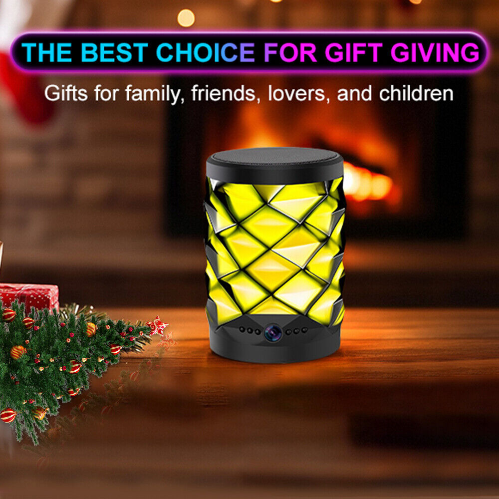 A Bluetooth Speaker SpyCam with a geometric yellow LED design sits on a wooden table near a Christmas tree and fireplace. It's a stylish gift for family or friends, perfect for covert home monitoring and 24/7 security.
