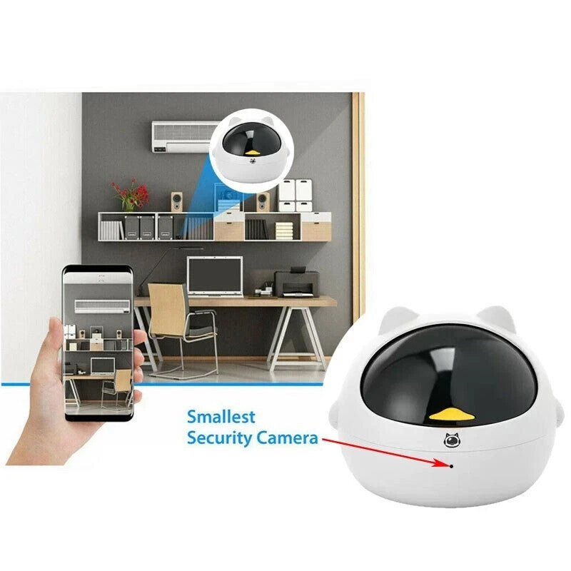 The Cute Display SpyCam, shaped like a kitty, discreetly monitors a modern office. Live 1080P footage appears on a smartphone. A label points to it as the "Smallest Security Camera"—perfect for subtle home surveillance.